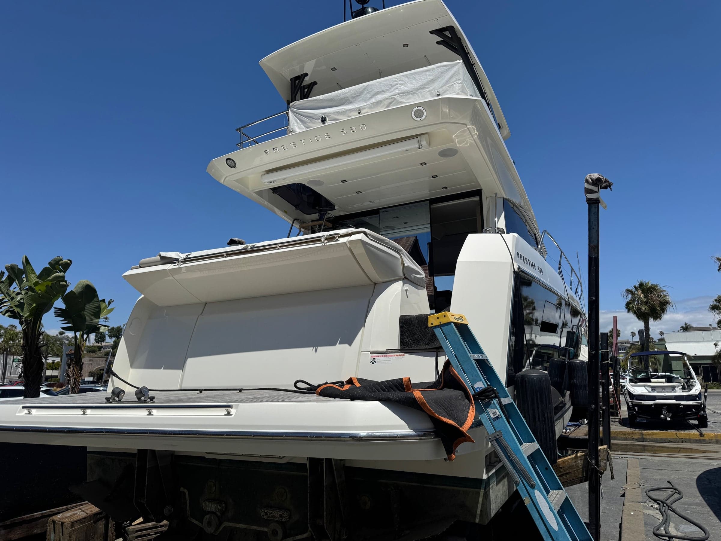 Side view of a yacht at the dock during a scheduled service visit