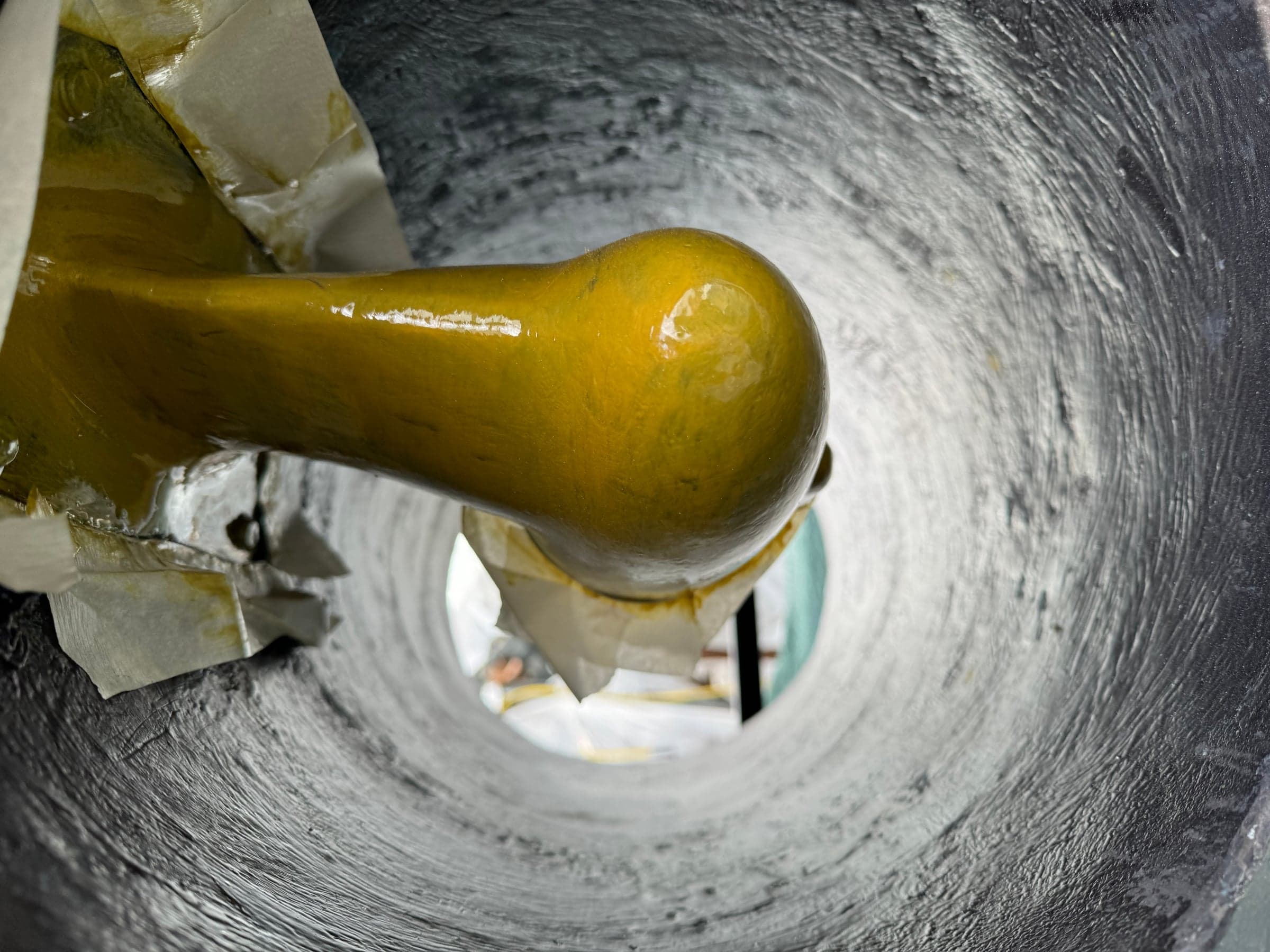Looking up through a bow thruster tunnel showing the thruster shaft and propeller