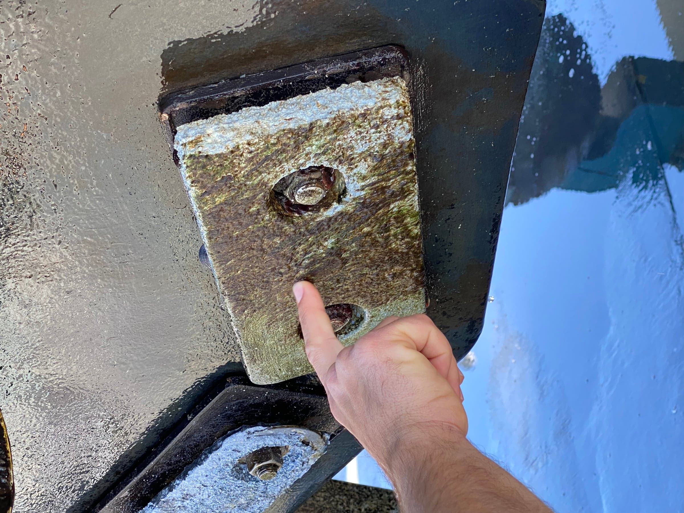 Hand pointing at a hull anode that is still fully formed