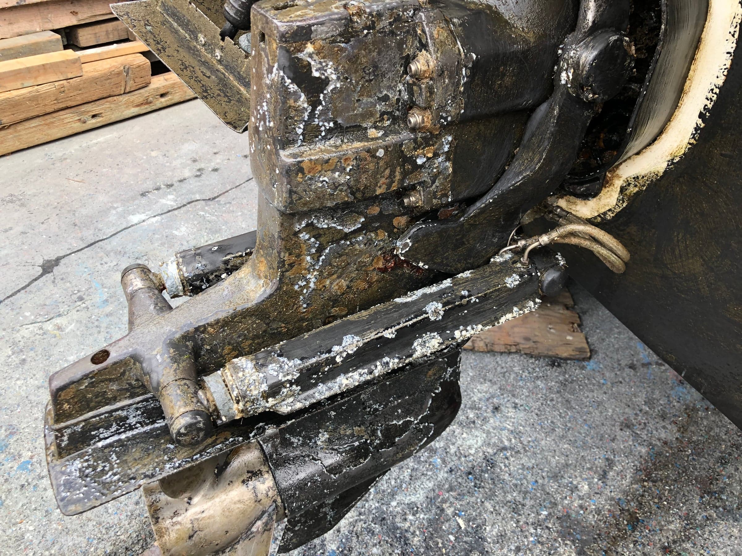 Sterndrive lower unit pulled, severe white pitting and corrosion across housing
