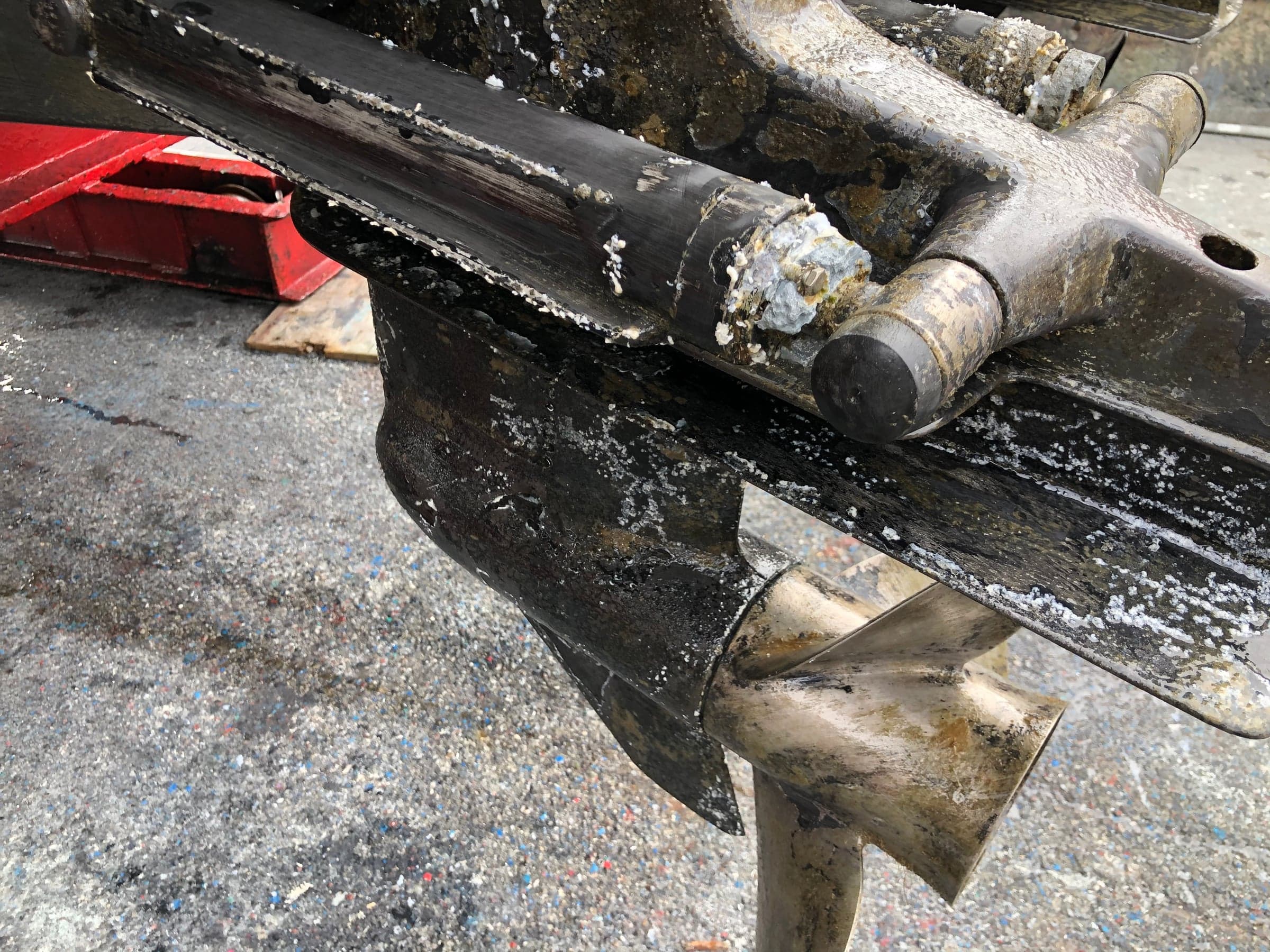 Aluminum sterndrive lower unit with extensive flaky corrosion, propeller off